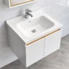 Cấu tạo chậu lavabo sứ liền mặt men Nano Eurolife BLV-IN04 với lòng chậu bo cong, lỗ chống tràn và vị trí lắp vòi, đặt trên tủ trắng phối Gold.